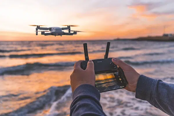 person flying a remote controlled drone
