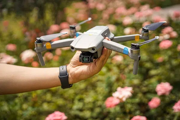 person holding drone in hand